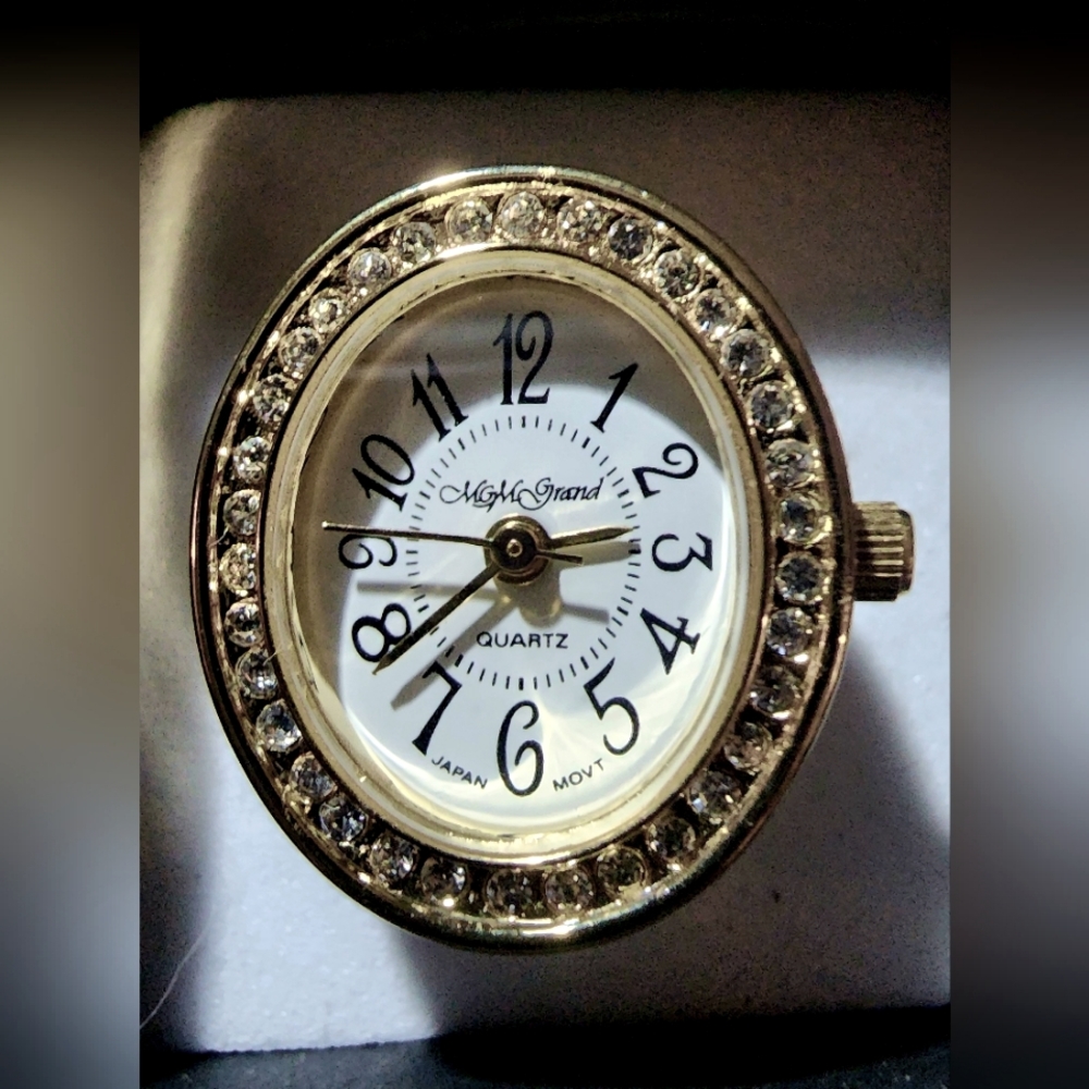 Ladies cubic zirconia gold plated finger ring from MGM Grand > Adjustable band.